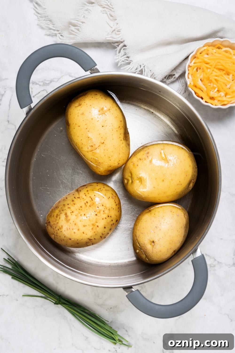 Four potatoes in a pot.