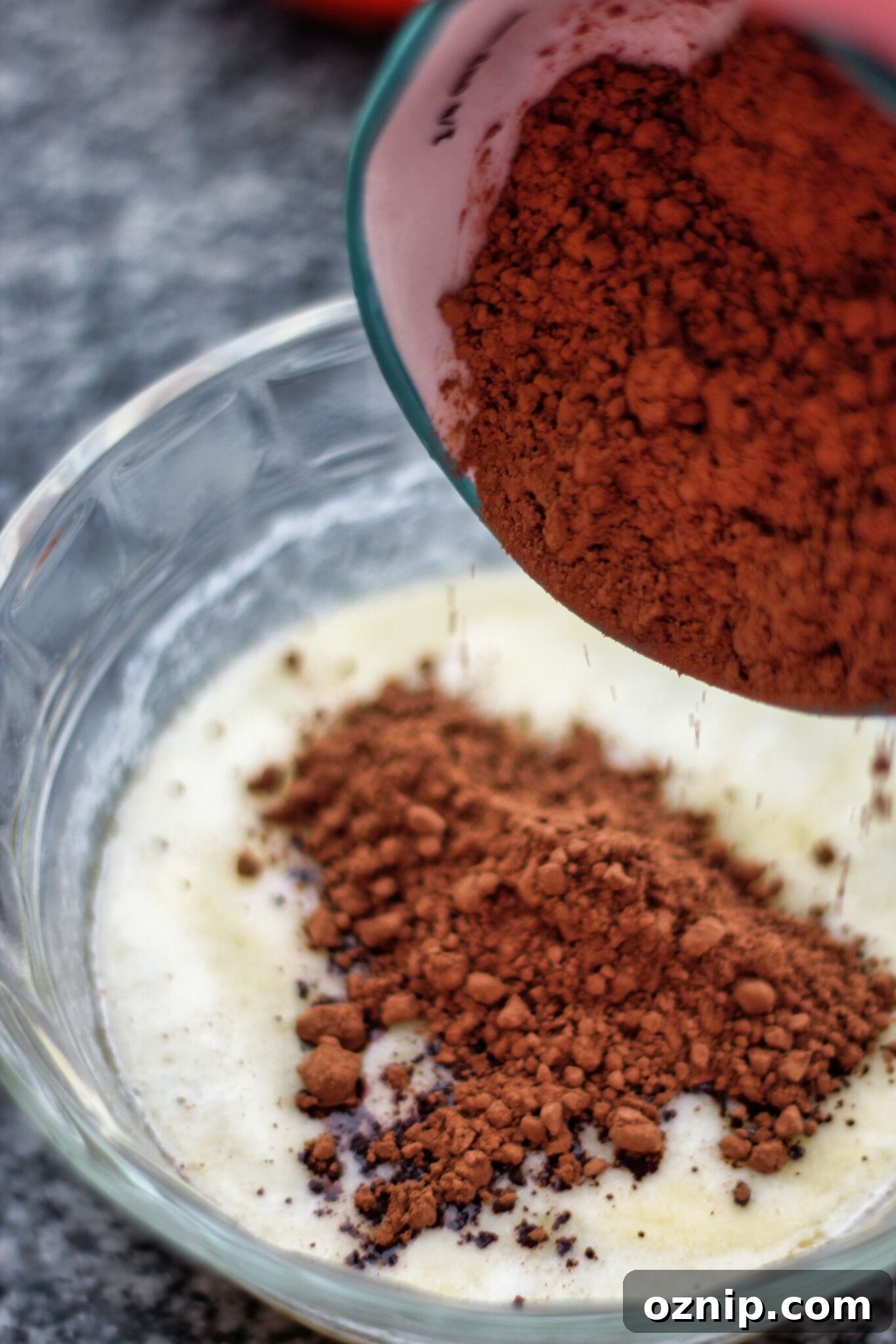 adding cocoa to melted butter