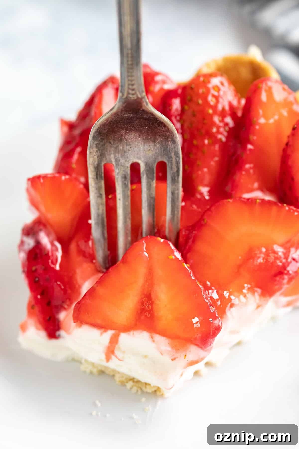 Strawberry Cream Cheese Pie Recipe with Fresh Strawberries 10 A close up image of a fork piercing into the strawberry pie with cream cheese.