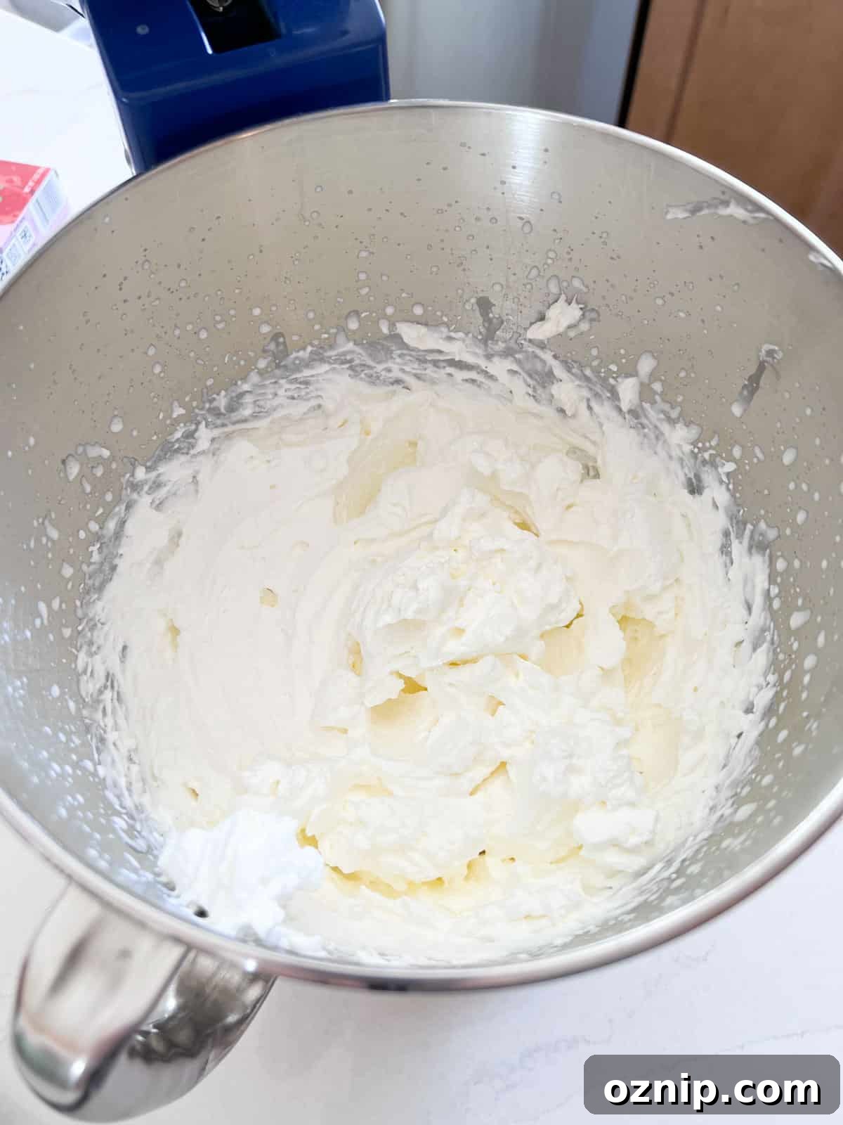 Strawberry Cream Cheese Pie Recipe with Fresh Strawberries 5 Whipped cream in a stand mixer bowl after being whipped in to stiff peaks.