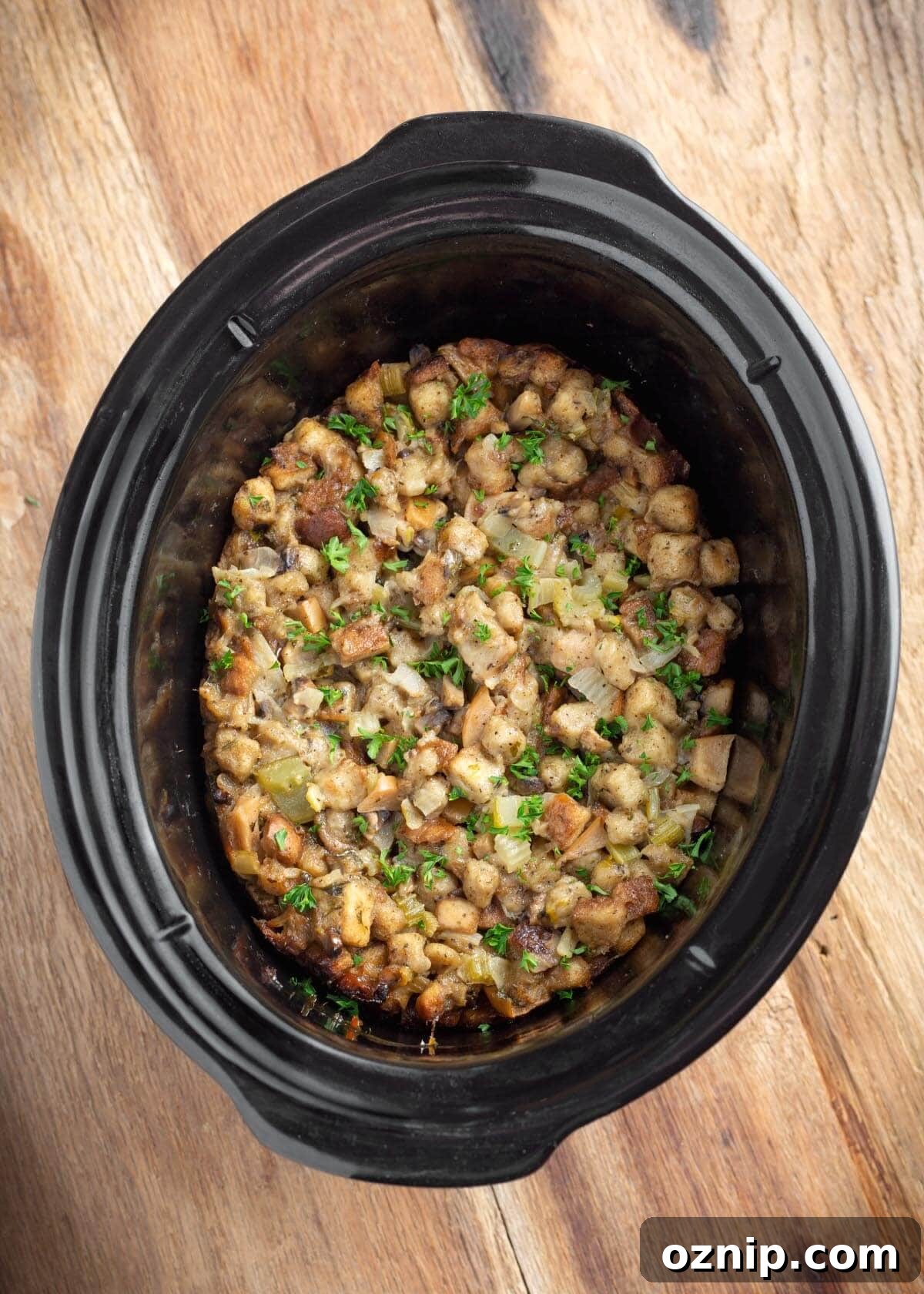 easy slow cooker stuffing cooked in a black crock