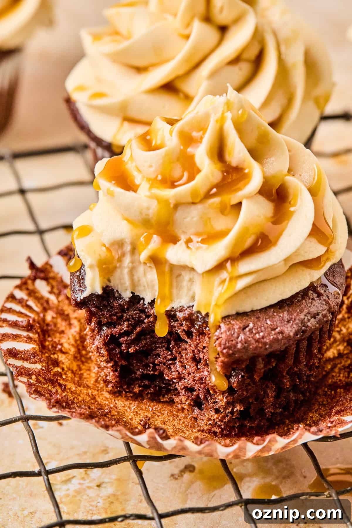 Salted Caramel Mocha Cupcakes 4 Cafe mocha cupcake with caramel frosting with bite taken out.