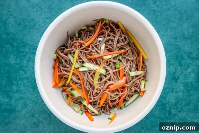 Spicy Cold Noodle Salad with Peanut Sauce 2 Asian flavored cold noodle salad in a bowl with soba noodles