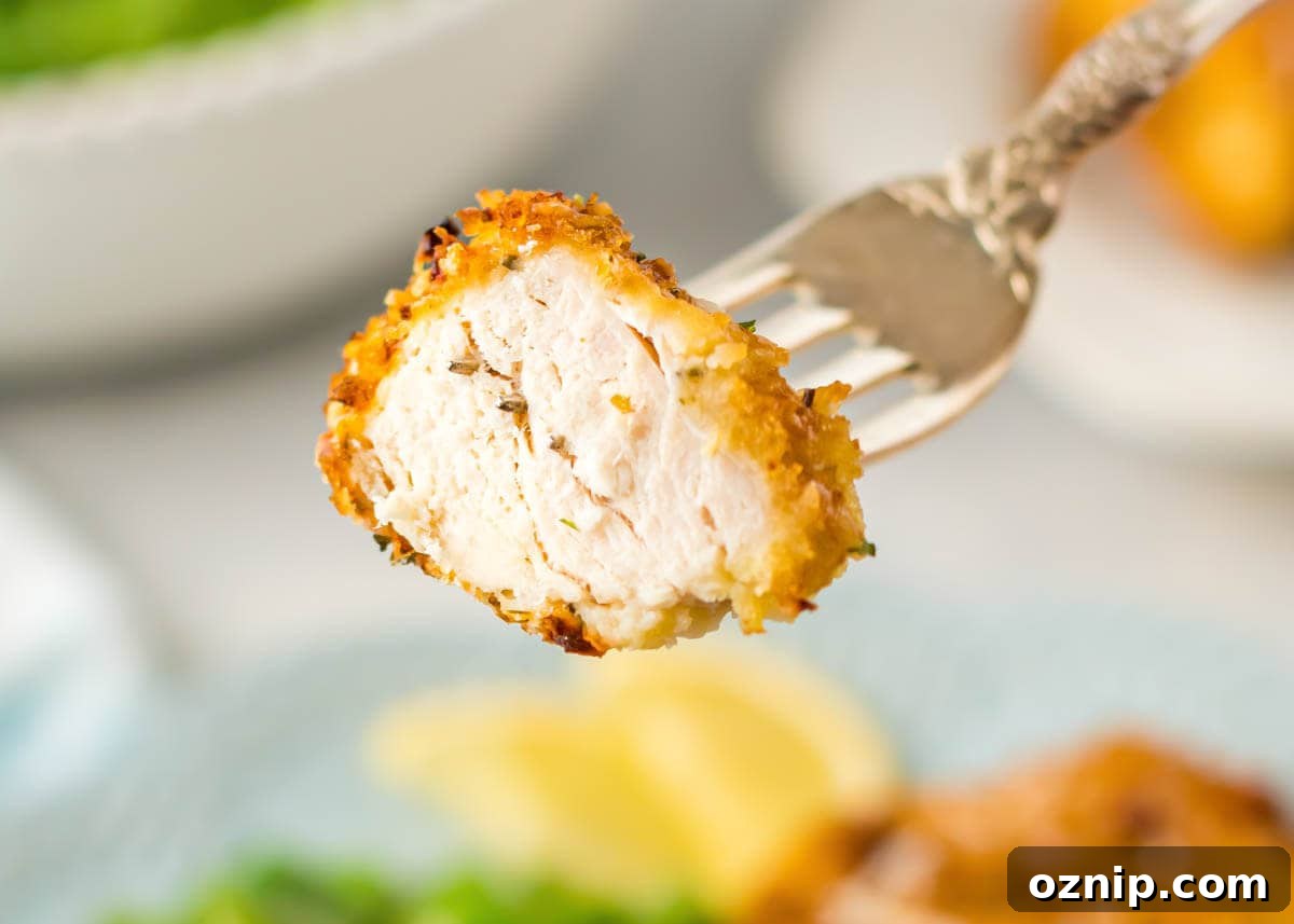 Air Fryer Parmesan Crusted Chicken Recipe 5 Air Fryer Parmesan Crusted Chicken on a fork