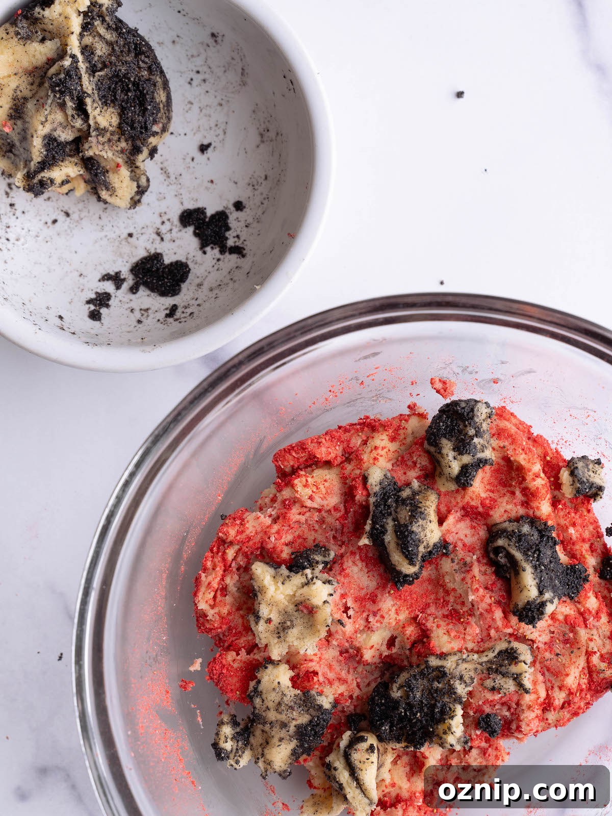 Swirling strawberry and black sesame cookie dough together