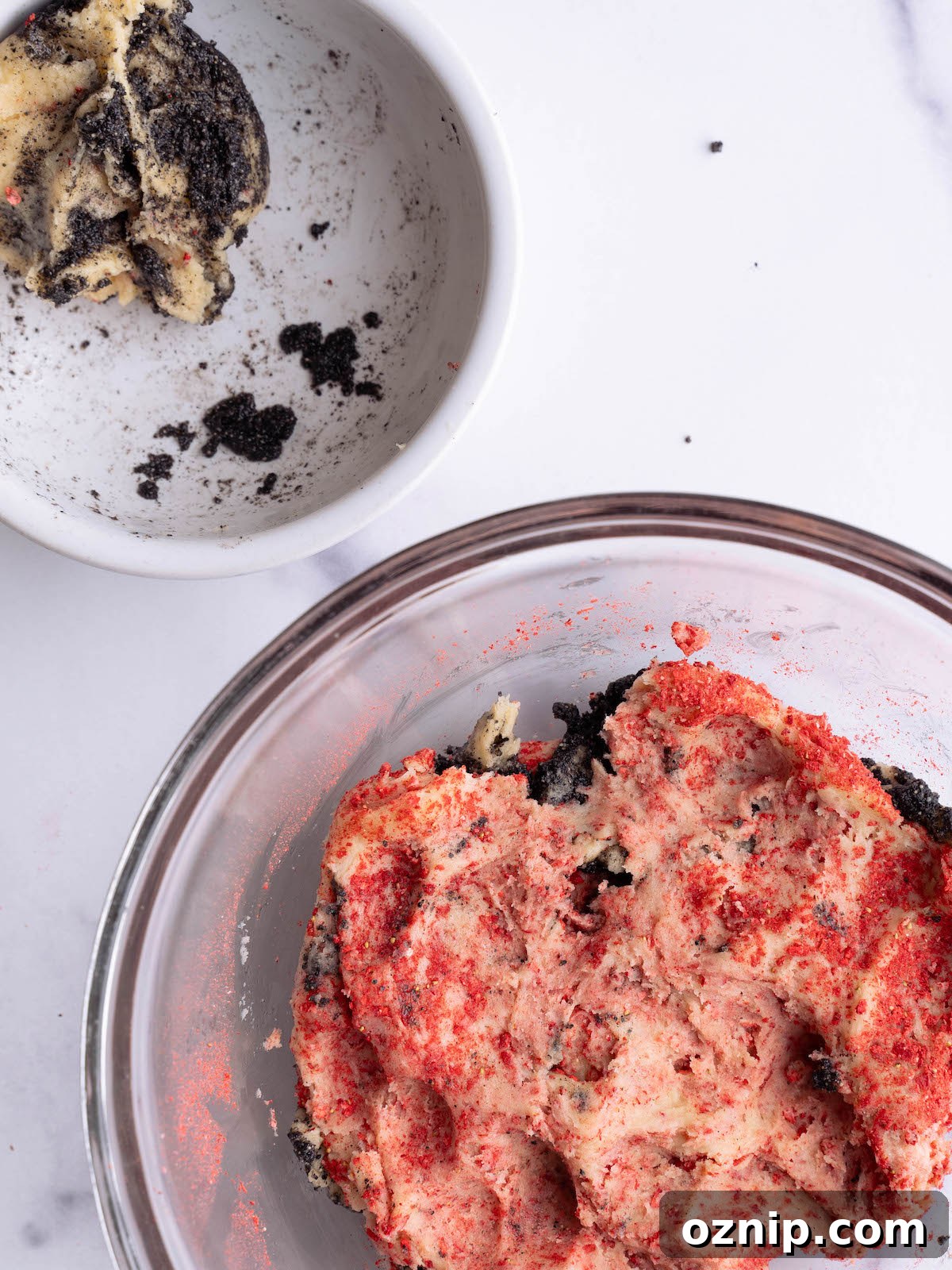 Mixing two cookie doughs together to create a swirl effect