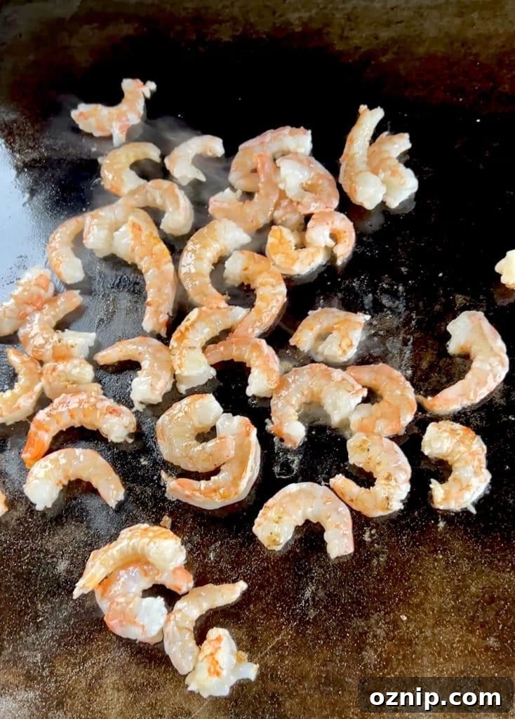 Cooking jumbo shrimp on blackstone griddle.