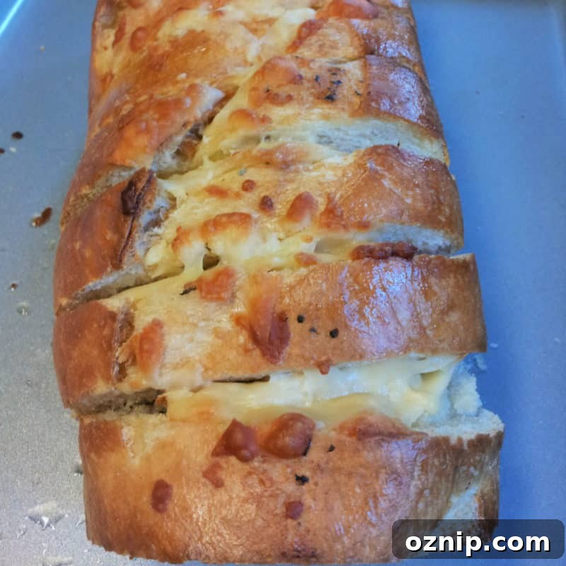 30+ Side Dishes for Soup to Complete Your Meal 12 cheesy garlic bread on a baking sheet