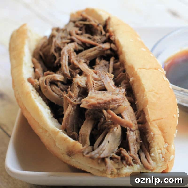 30+ Side Dishes for Soup to Complete Your Meal 14 French dip sandwich on a roll next to a bowl of au jus sauce
