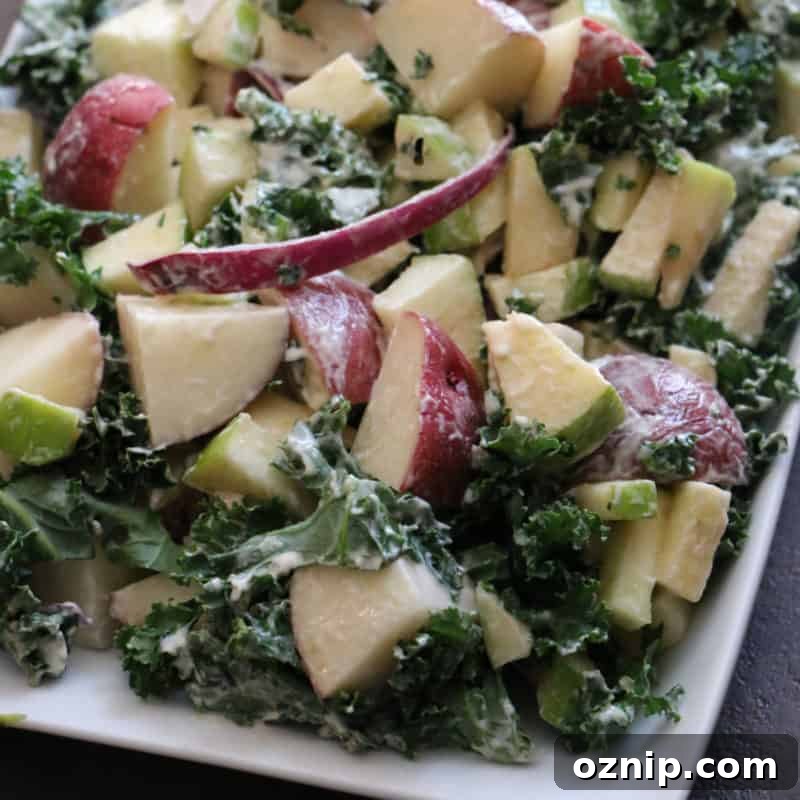 30+ Side Dishes for Soup to Complete Your Meal 18 apple, kale, and potato salad on a white platter
