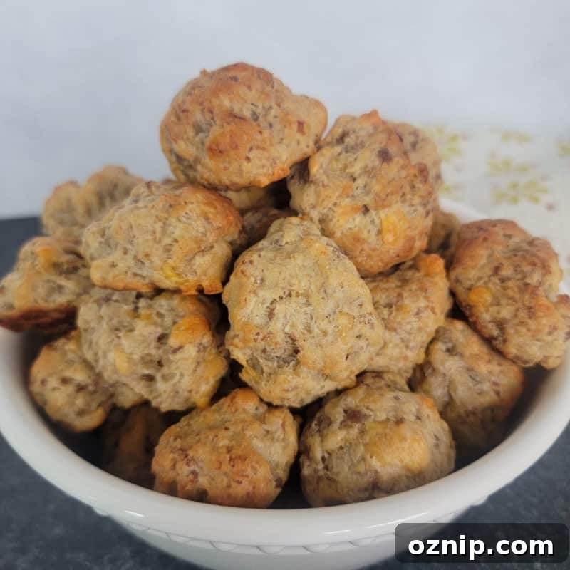 30+ Side Dishes for Soup to Complete Your Meal 21 White bowl filled with Cheddar Bay Sausage Balls next to a cloth napkin
