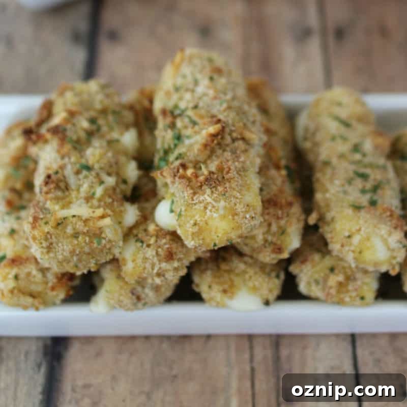 30+ Side Dishes for Soup to Complete Your Meal 28 Homemade Baked Mozzarella Sticks on a white platter