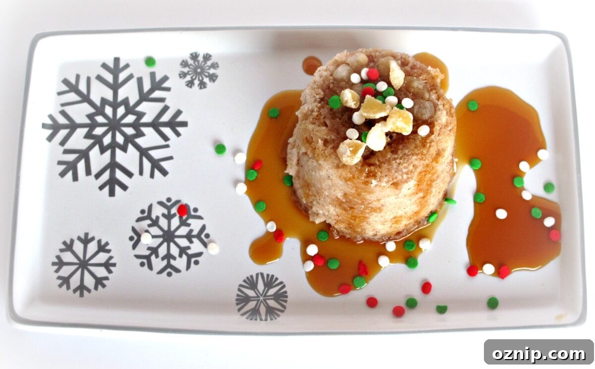 Gingerbread Mug Cake plated Gingerbread Mug Cake turned out onto a platter with ginger and caramel syrup.