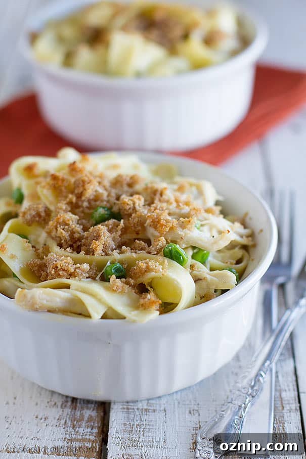 This Garlic Parmesan Chicken Pasta is made easy by using precooked, shredded chicken. A garlic parmesan sauce coats the chicken and homestyle noodles in this fast and comforting casserole.