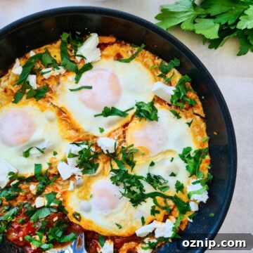 Feta Shakshuka Recipe with Poached Eggs 15 Shakshuka with feta in a pan