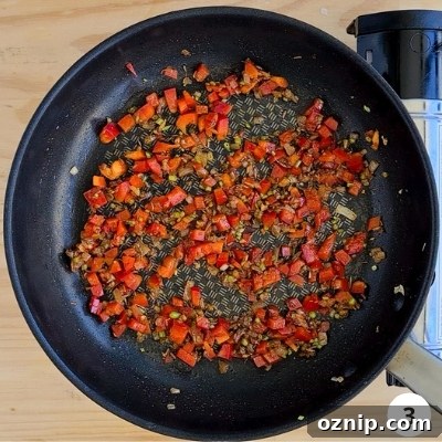 Feta Shakshuka Recipe with Poached Eggs 6 capsicum/red pepper added into pan