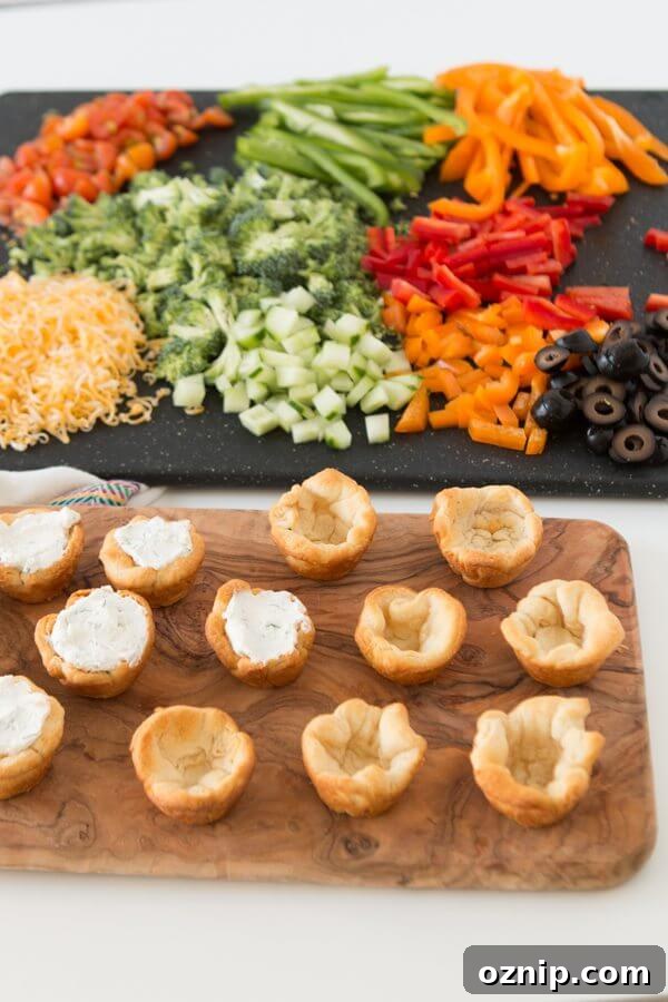 Quick and easy veggie pizza tarts with the best filling I've had for this easy appetizer
