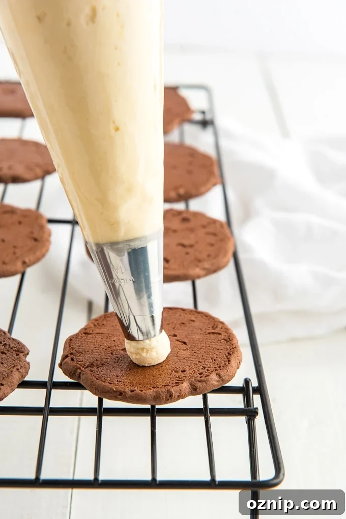 Filling chocolate cookies with buttercream frosting