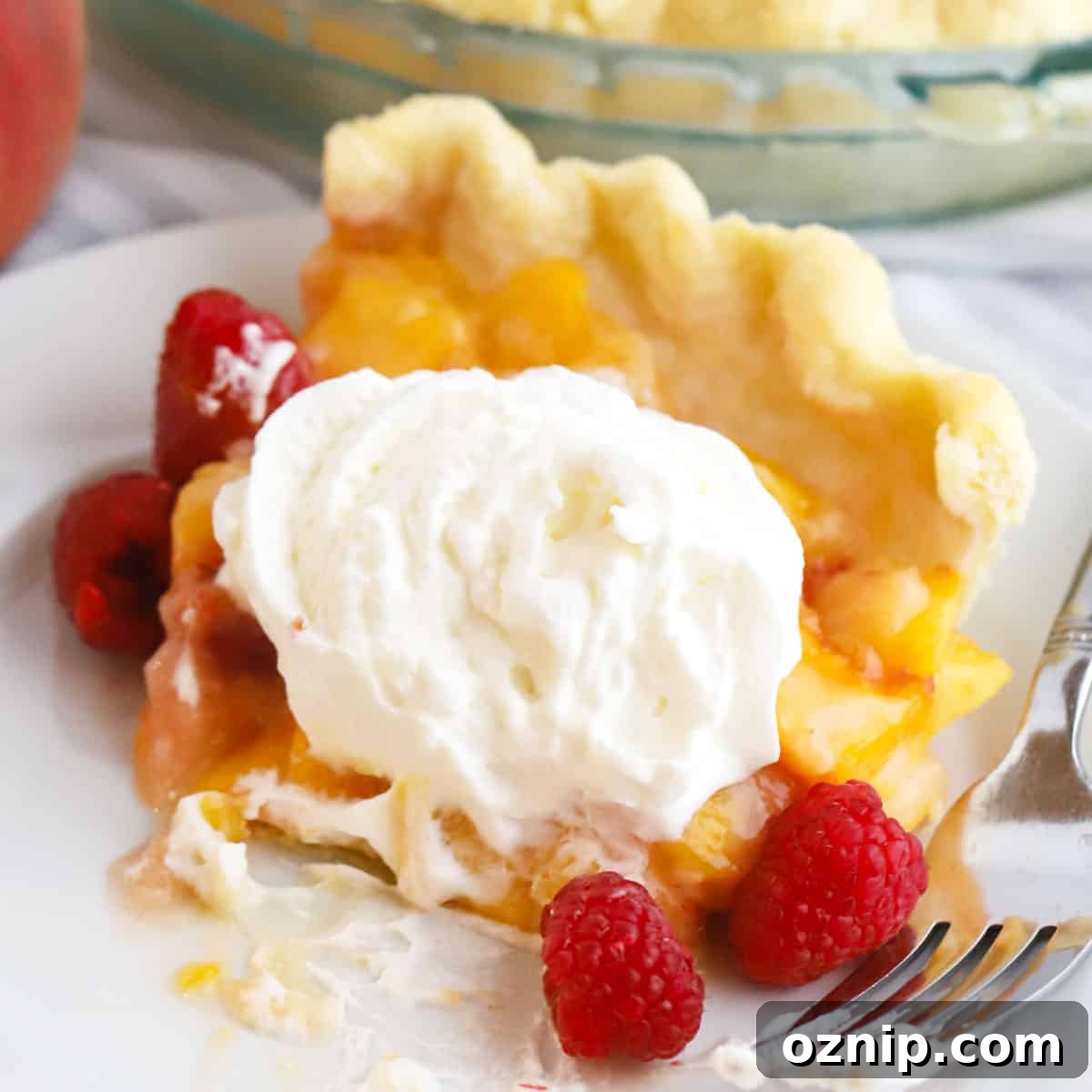 Baked Peach Pie with a Flaky Golden Crust 7 Fresh peach and raspberry pie recipe.