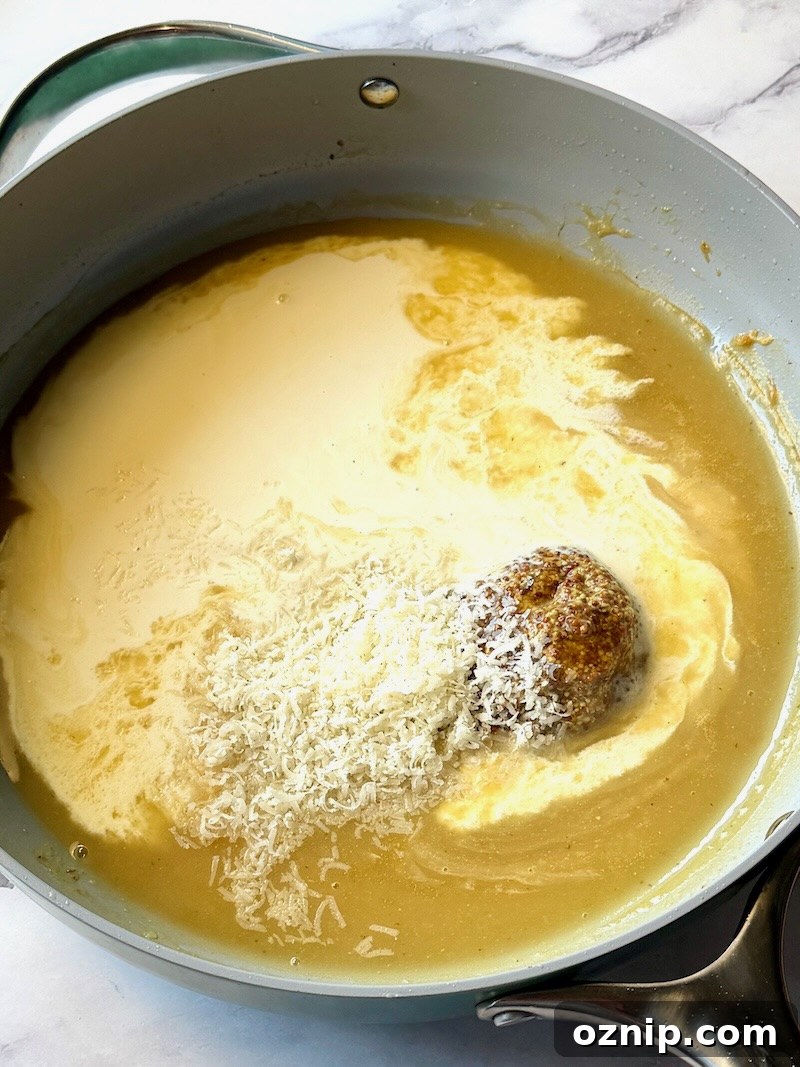 Creamy Honey Mustard Chicken with Broccoli 9 heavy cream, honey, mustard, and parmesan cheese added to the thickened broth.