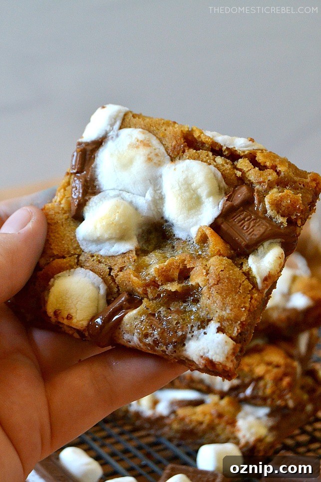 author holding a s'mores cookie bar