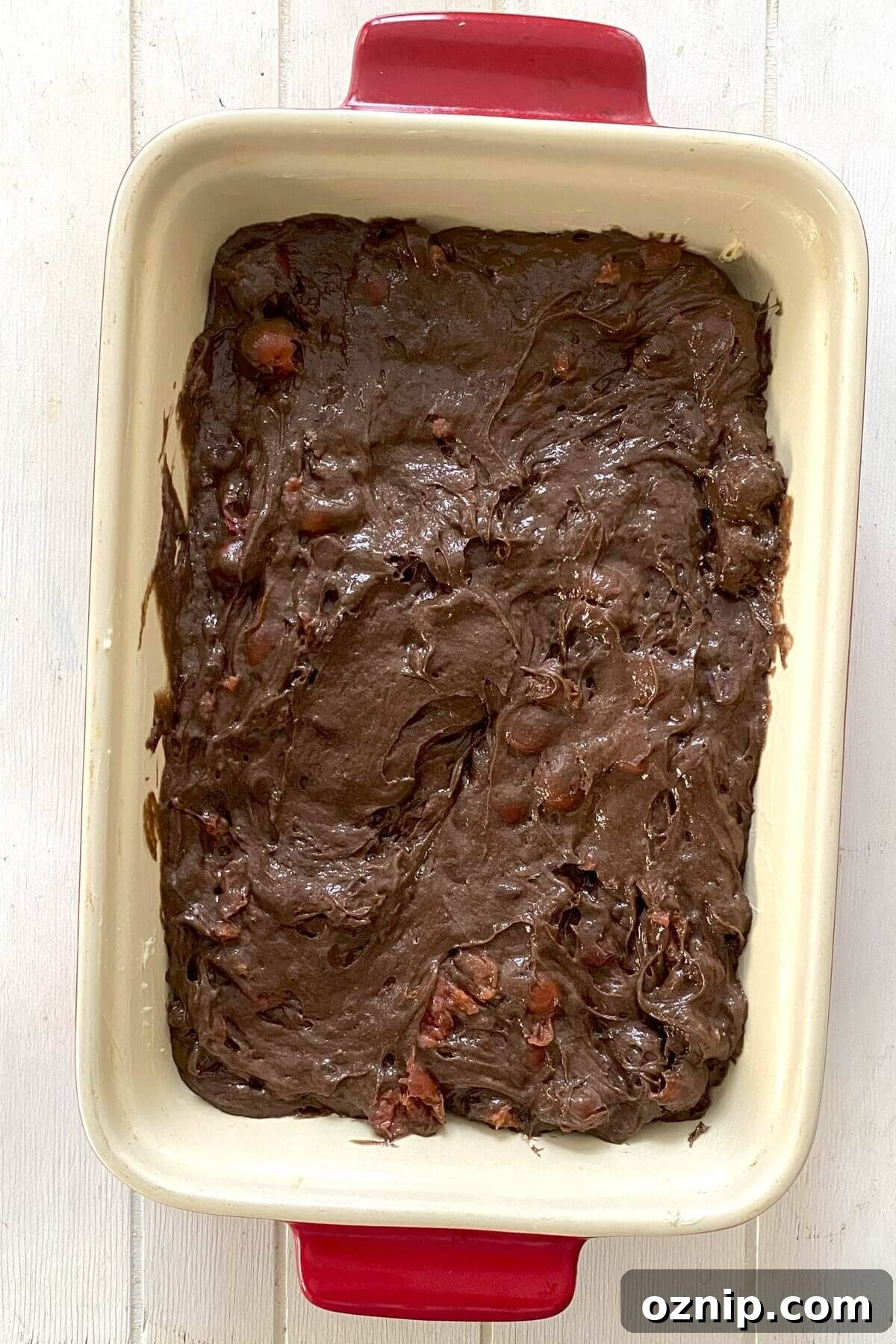 The cake batter in a baking pan.
