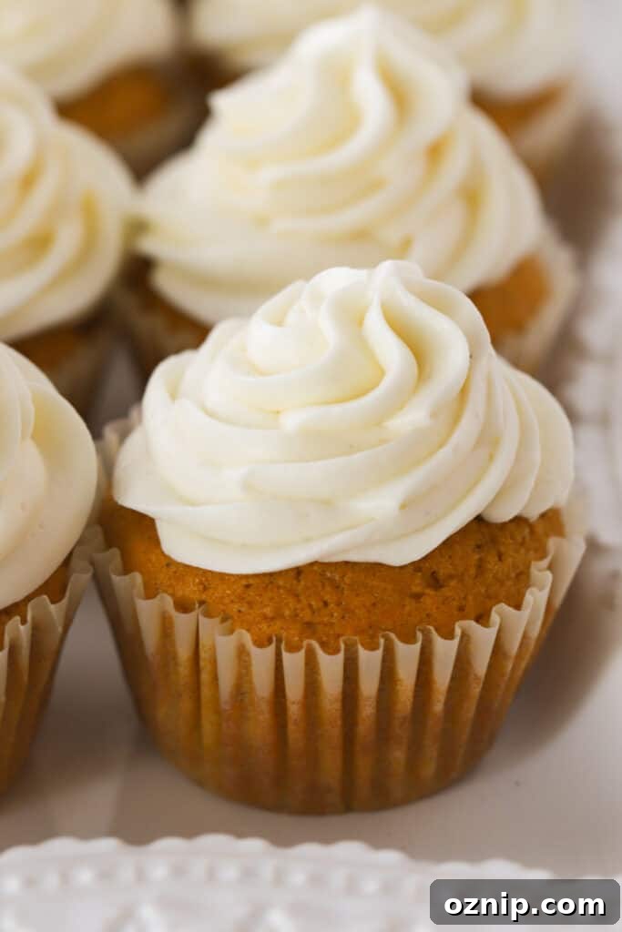 Pumpkin cupcakes topped with cream cheese frosting