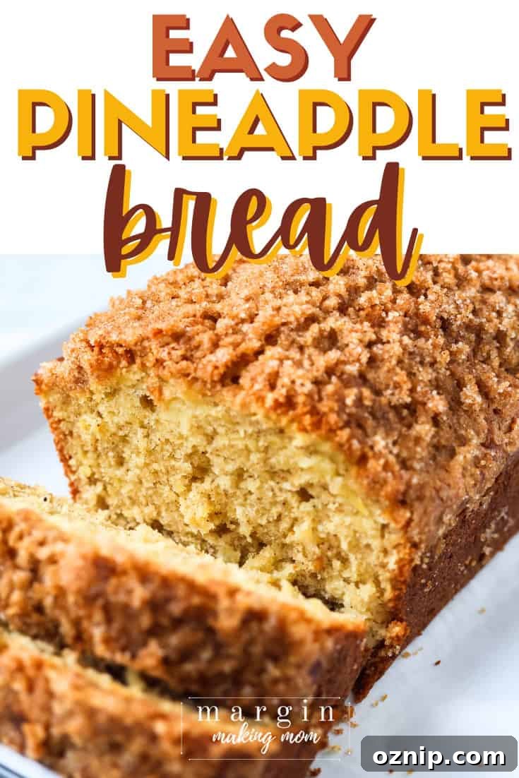 angled view of a loaf of pineapple bread, which is sliced.
