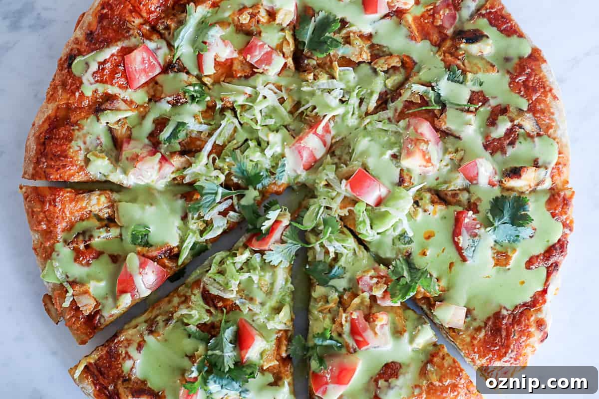 Homemade Chicken Taco Pizza with chicken breast, mexican cheese and vegetables