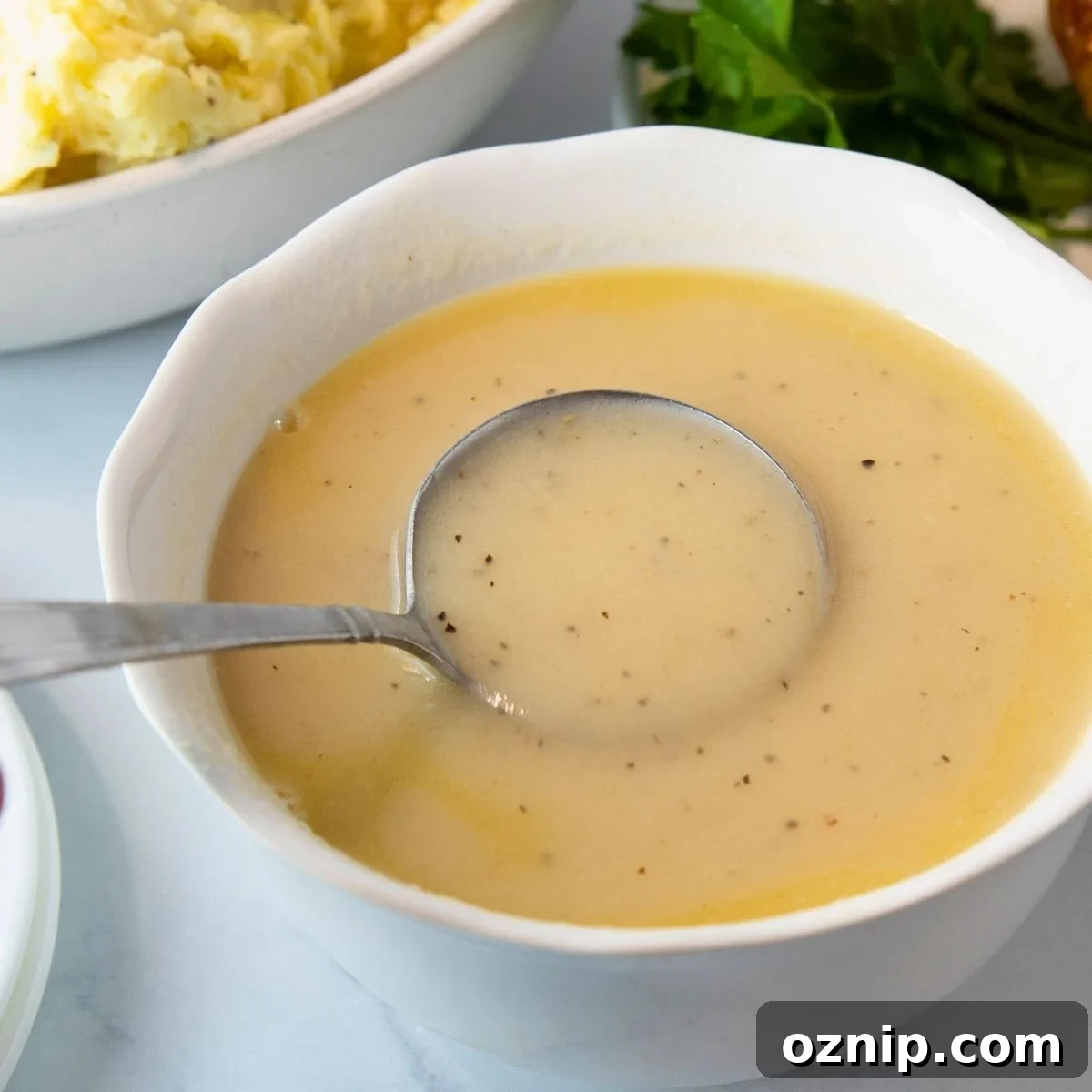 easy homemade chicken gravy in a white bowl ready to serve