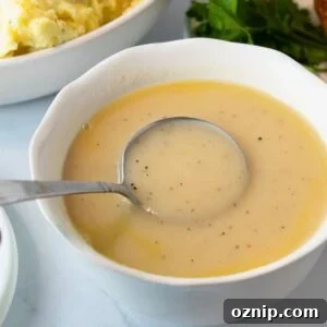 easy homemade chicken gravy in a white bowl ready to serve