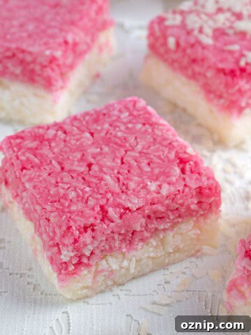 A few squares of coconut ice on a lace tablecloth.
