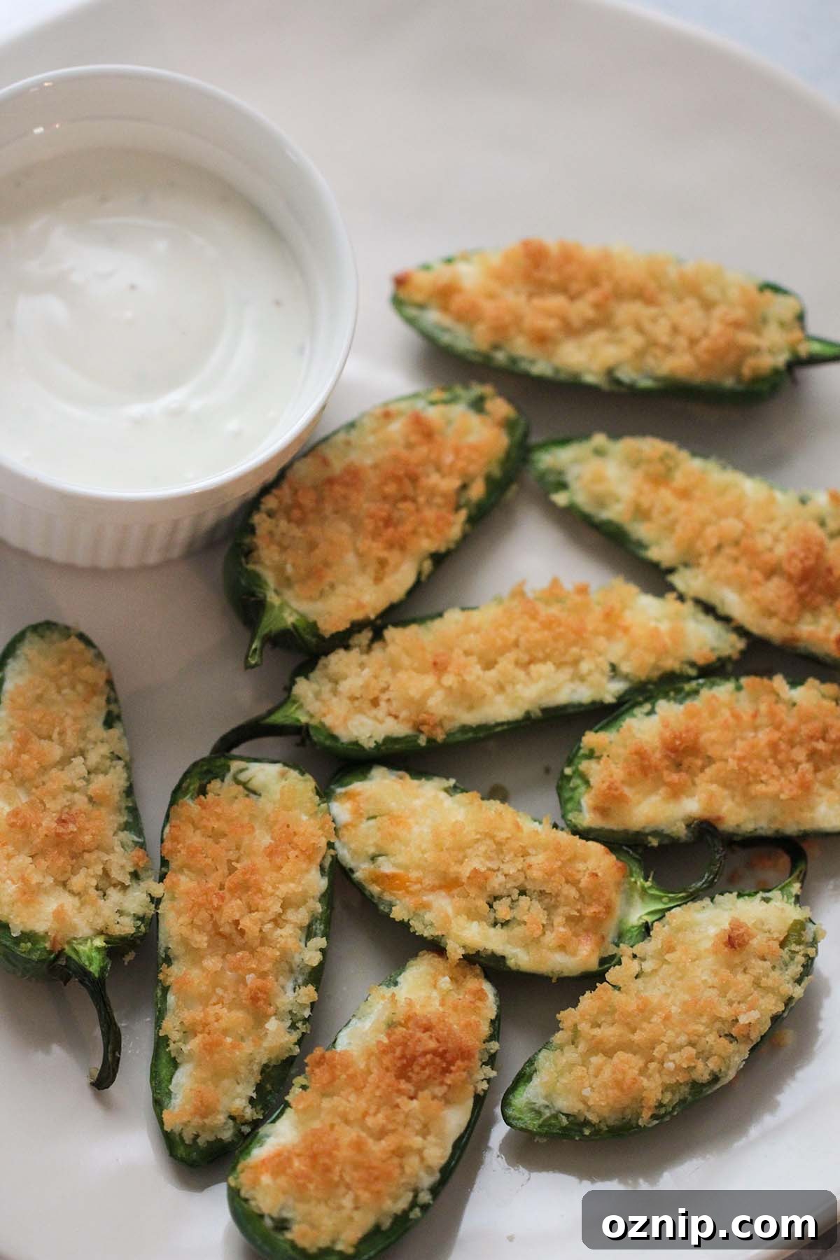 air fryer jalapeno poppers with a side of blue cheese dressing.