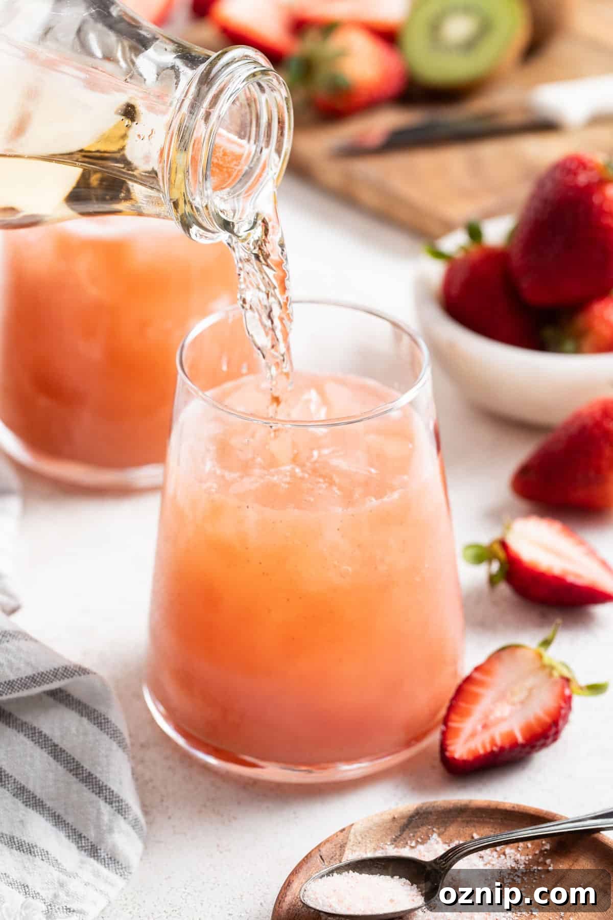 Strawberry Cocktail to Reduce Cortisol, No Orange Juice 8 Pouring sparkling water into the adrenal mocktail.