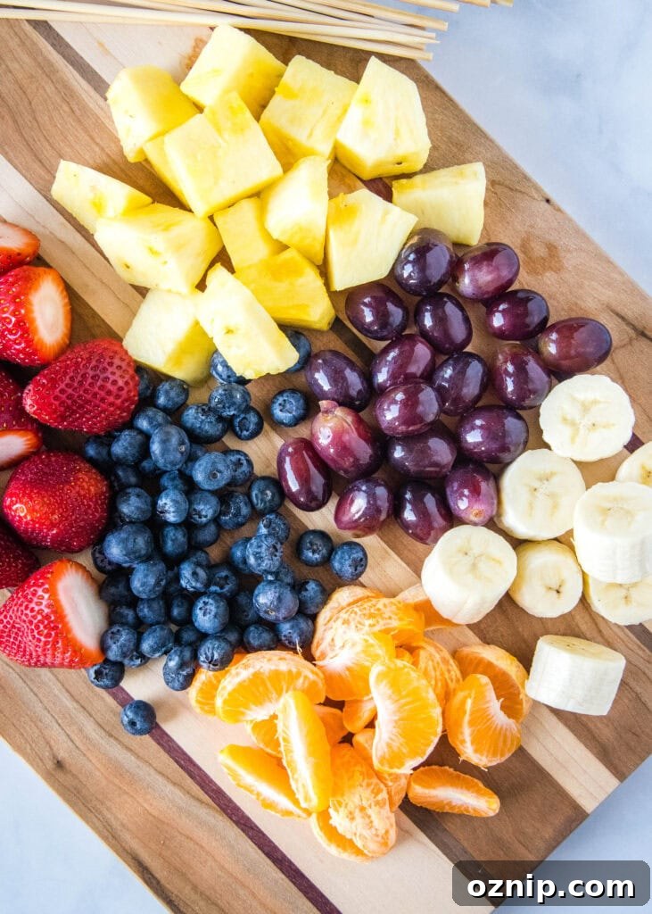 looking down on cutting board full of fresh fruit