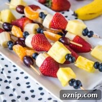 close up fruit kebobs on a plate