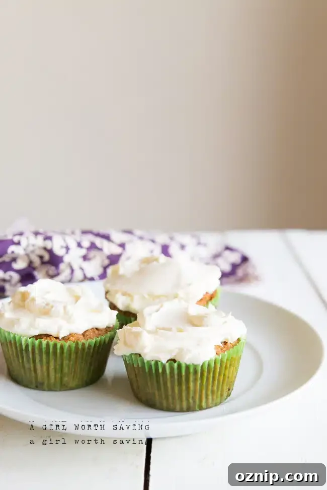 Moist Coconut Flour Carrot Cupcakes with Cream Cheese Frosting 3 three Coconut Flour Carrot Cupcakes on a plate