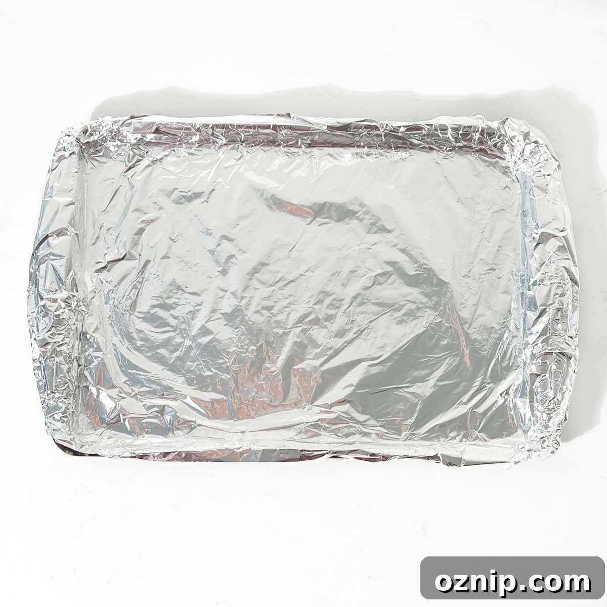 Whiskey Honey Glazed Pigs in Blankets 5 A foil lined baking tray.