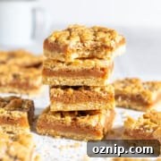 Four pieces of tan square stacked on top of each other.