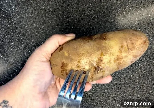 Pierce potato with a fork