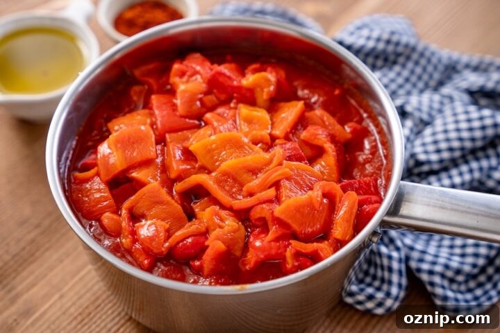 Roasted peppers added to tomato mixture