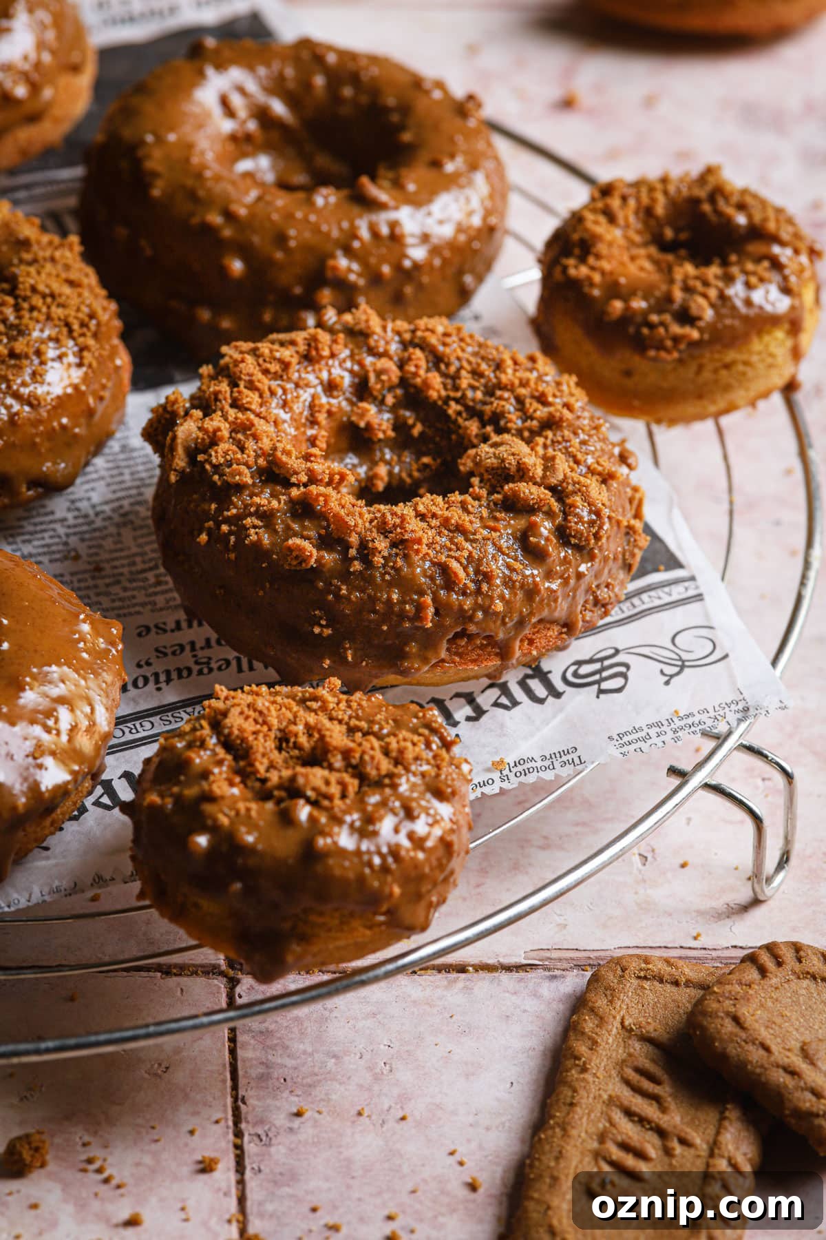 Moist Baked Pumpkin Donuts: Soft Fall Donut Recipe 2 baked pumpkin donuts with biscoff glaze.