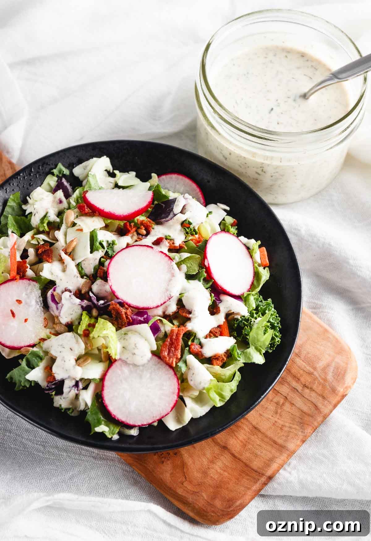 Serving a salad with the ranch dressing.