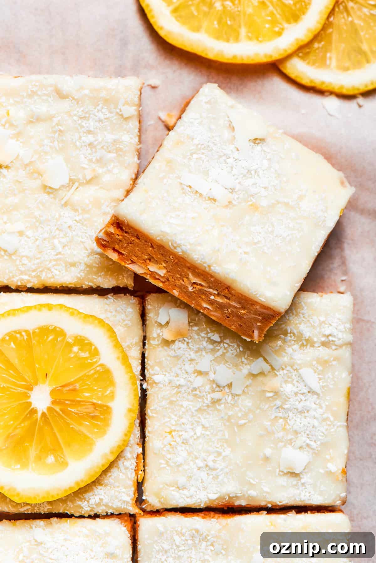 A square of lemon slice on top of other lemon slices.