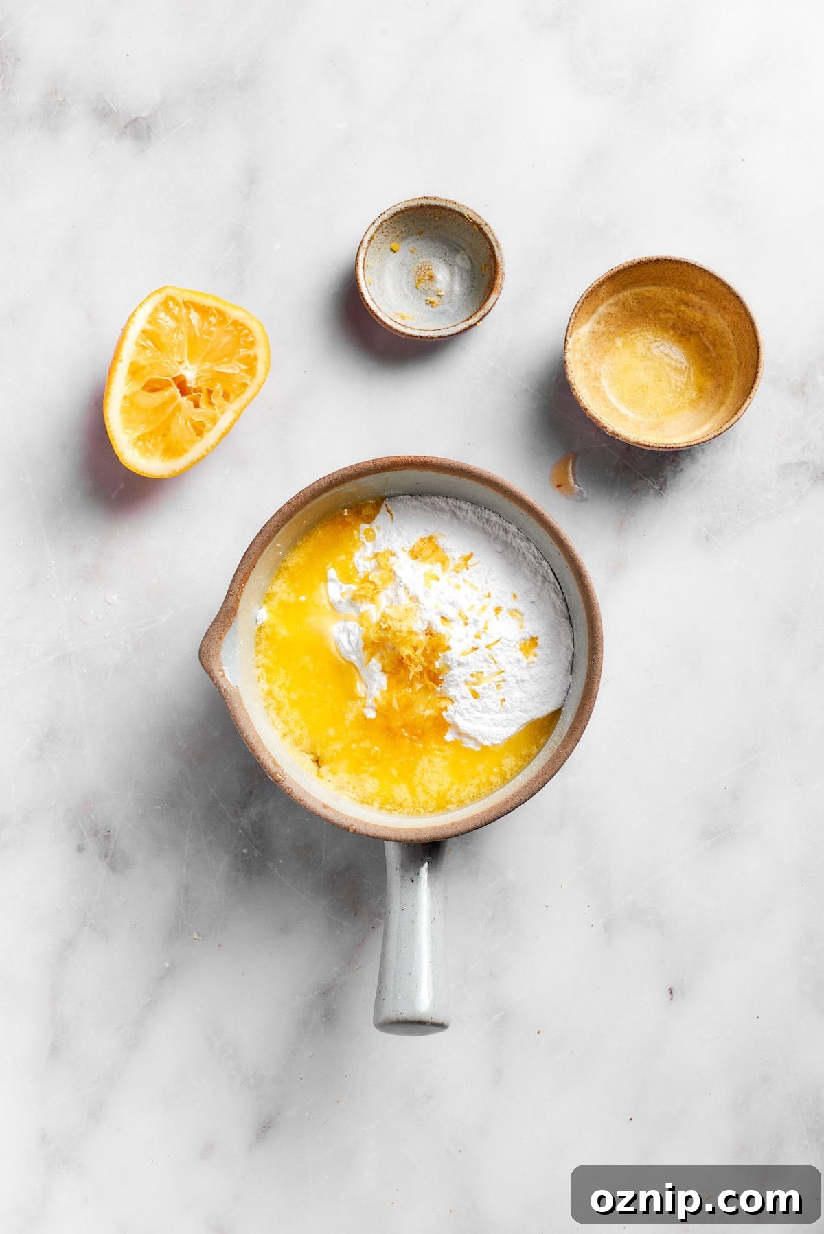 Mixing the frosting for lemon slice in a pot.