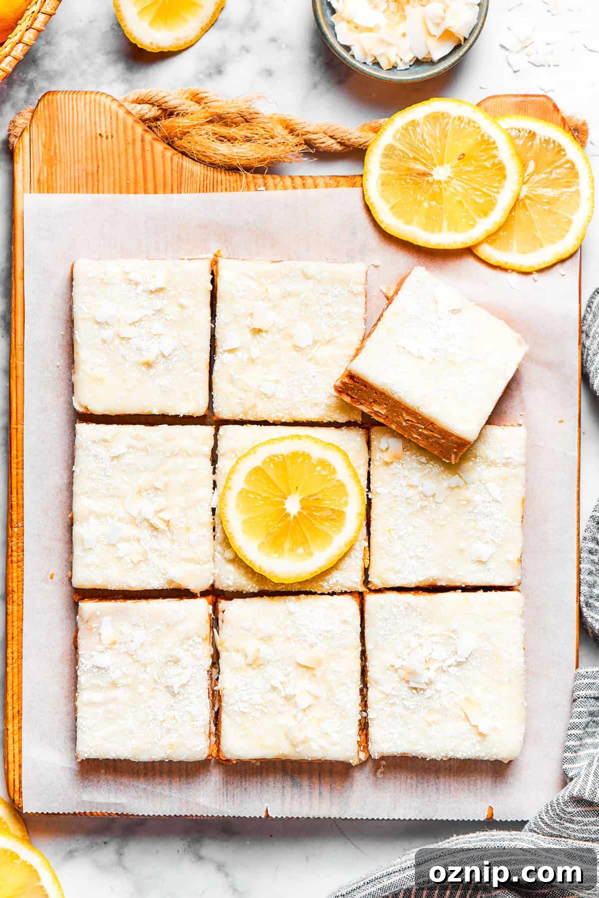 Squares of lemon slice topped with frosting.