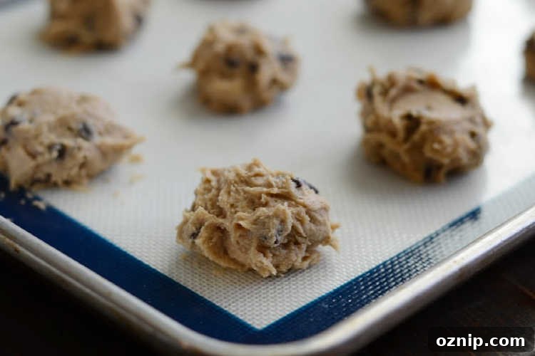 chocolate chip cookie dough on baking sheet