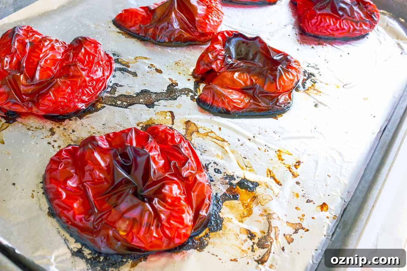 How to Roast Red Peppers: Oven, Grill and Stovetop Methods 4 Roasted red peppers cut side down on cookie sheet