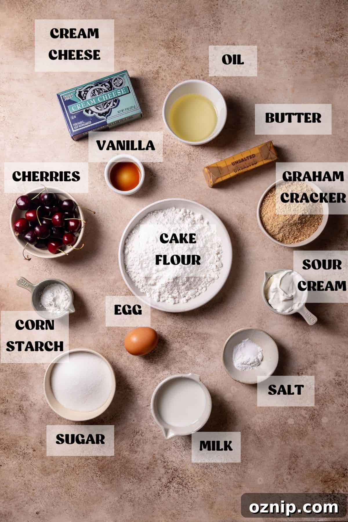 Cherry Cheesecake Cupcakes with Graham Cracker Crust 3 Ingredients needed to make cherry cupcakes in bowls with labels.