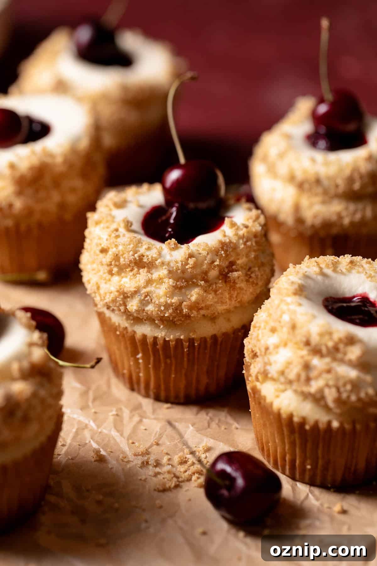 Cherry Cheesecake Cupcakes with Graham Cracker Crust 6 Cherry cupcakes with cherry filling rolled in graham cracker crumbs.